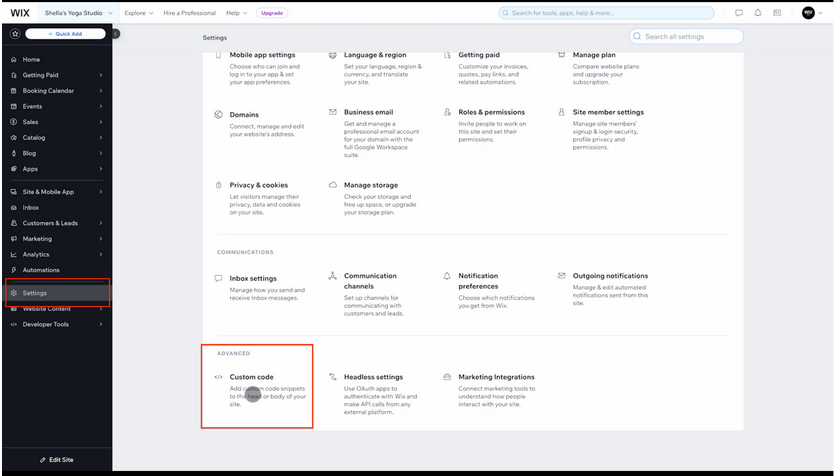 Wix Settings page with Custom Code highlighted under Advanced Settings